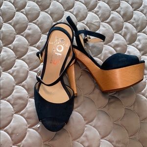 Never worn- Michael Kors Navy platform heels